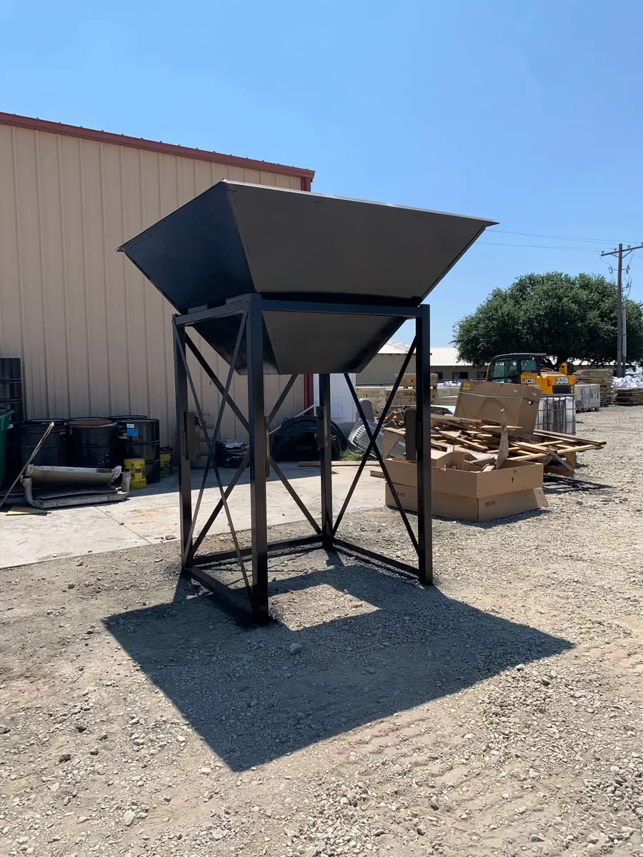 Heavy-duty steel hopper with welded seams and reinforced structure, fabricated by Marson Welding